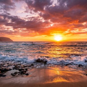 Ocean sunset with golden light, waves, rocks, and coastal cliffs – FHD desktop wallpaper